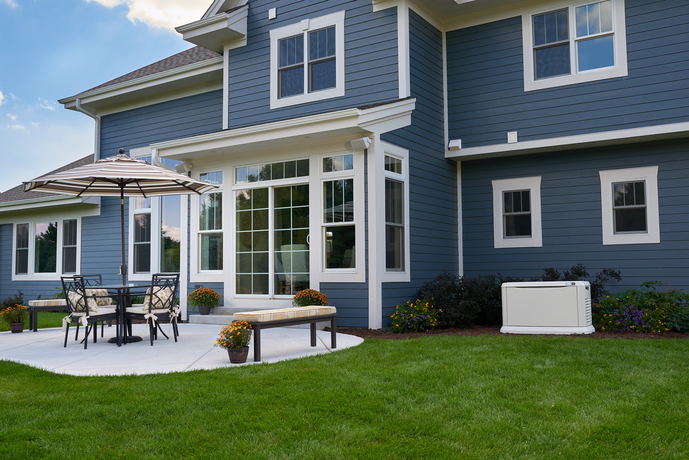 blue home with patio 